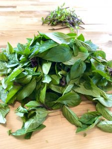 a pile of basil leaves