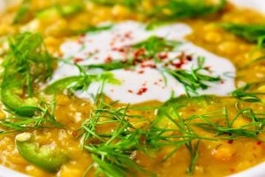 yellow lentil soup with dill, jalapenos, and yogurt