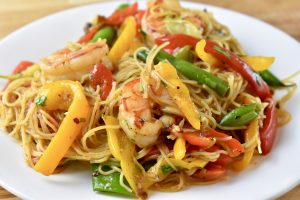 shrimp, green beans, and peppers on noodles