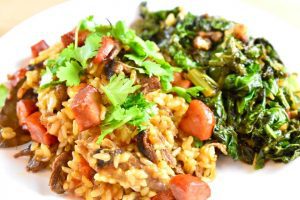 Portuguese duck rice with sauteed kale